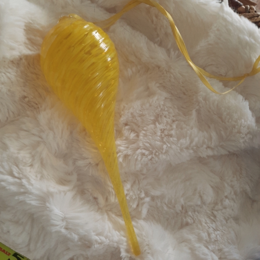 Hand-blown glass droplet ornament.